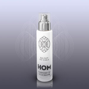Butelka balsamu do ciała Harmony of Microbiome na szarym tle