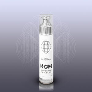 Butelka kremu do twarzy Harmony of Microbiome na szarym tle